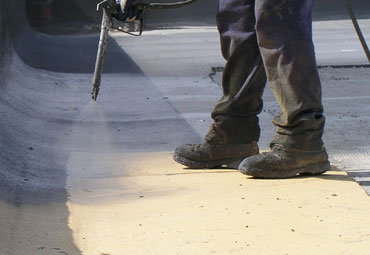 Coating systems over Cary spray foam roof systems